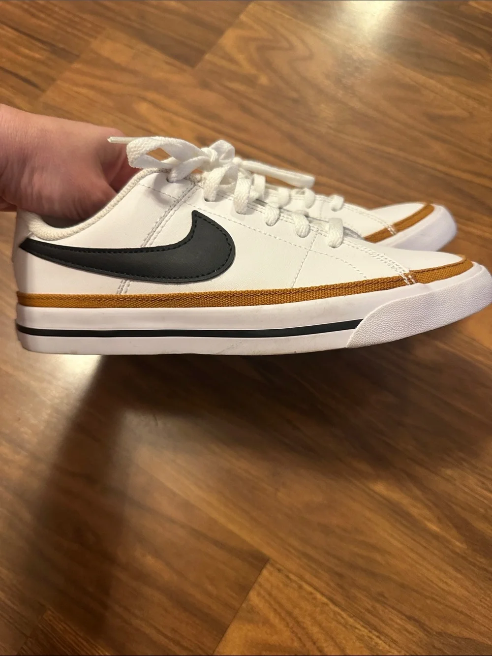 Nike Kid Low-Top Sneakers in White, Black & Gold